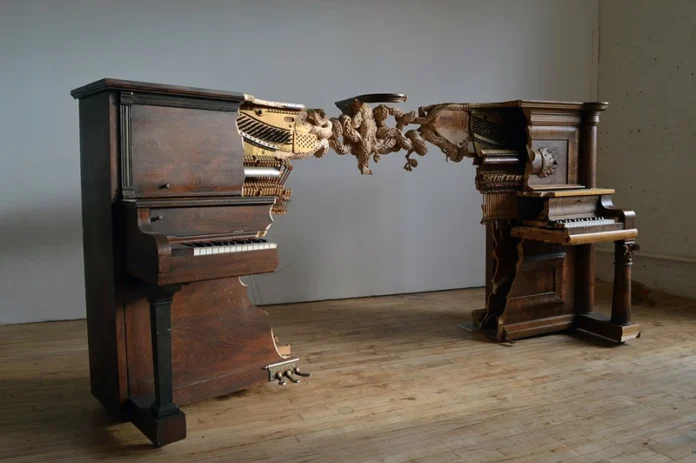 An Artist Transformed Two Pianos into One Sculpture by Connecting Them with a Carved Octopus